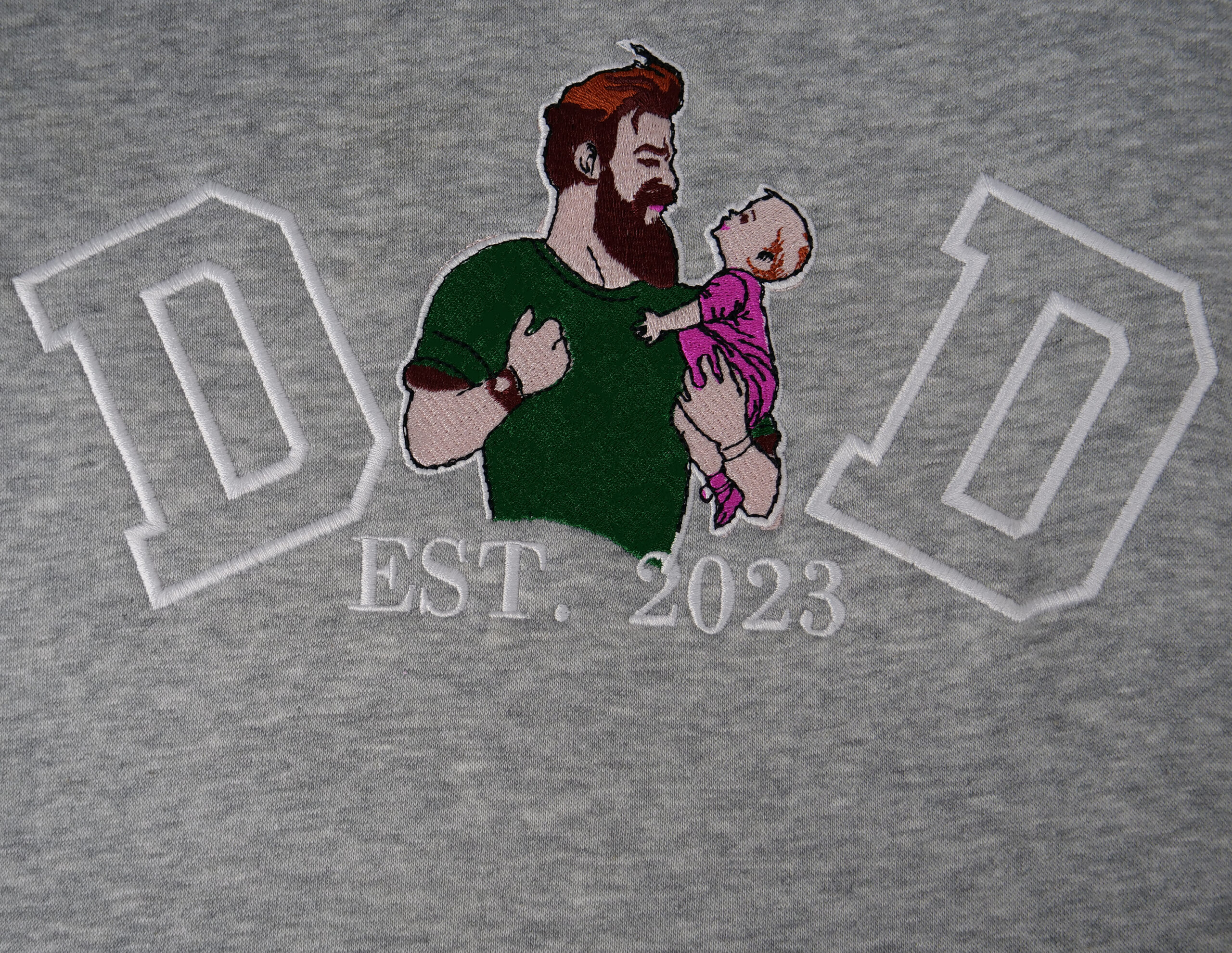 Custom “Dad Est. 2023” portrait embroidery