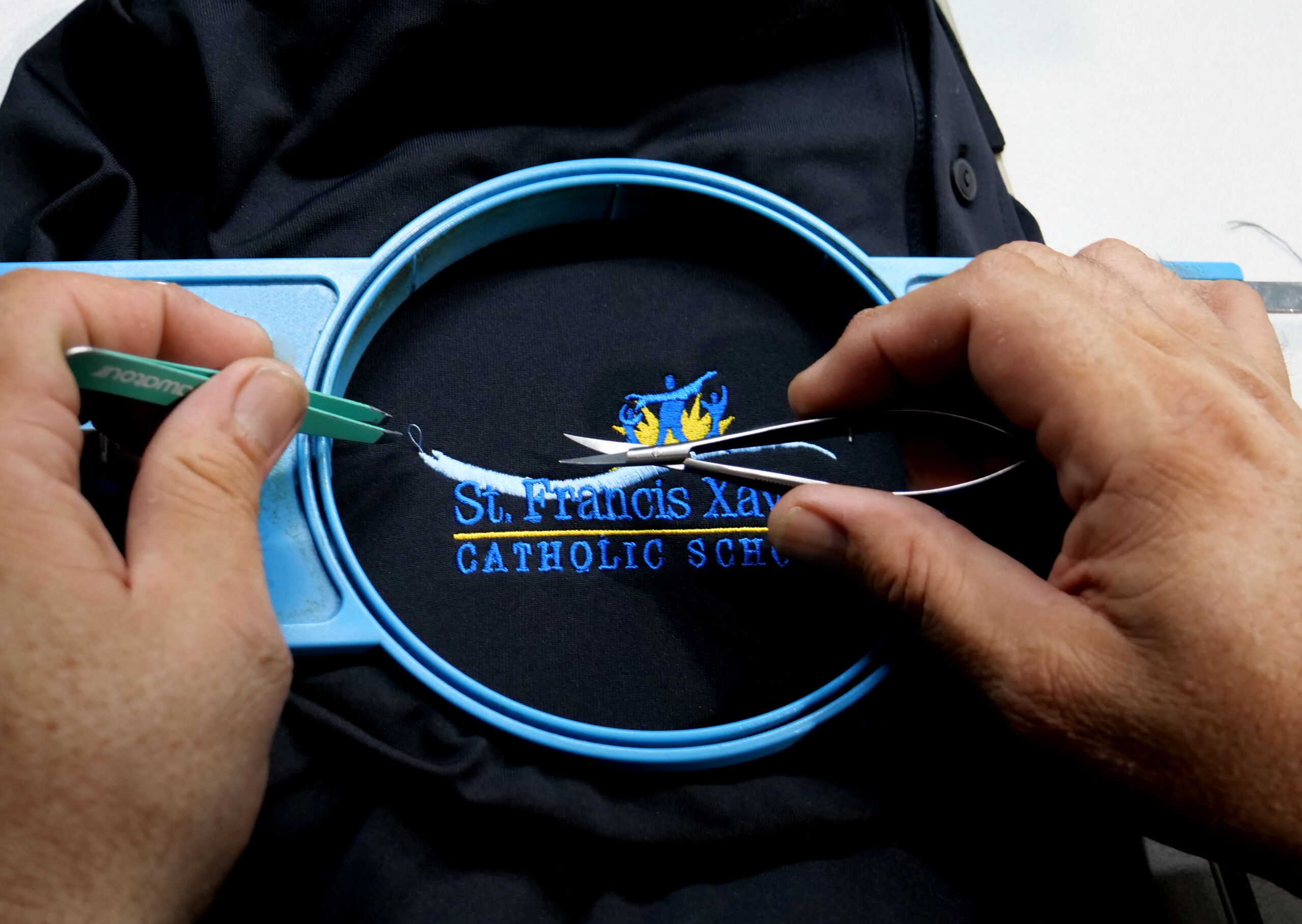 School logo embroidery, finished by hand